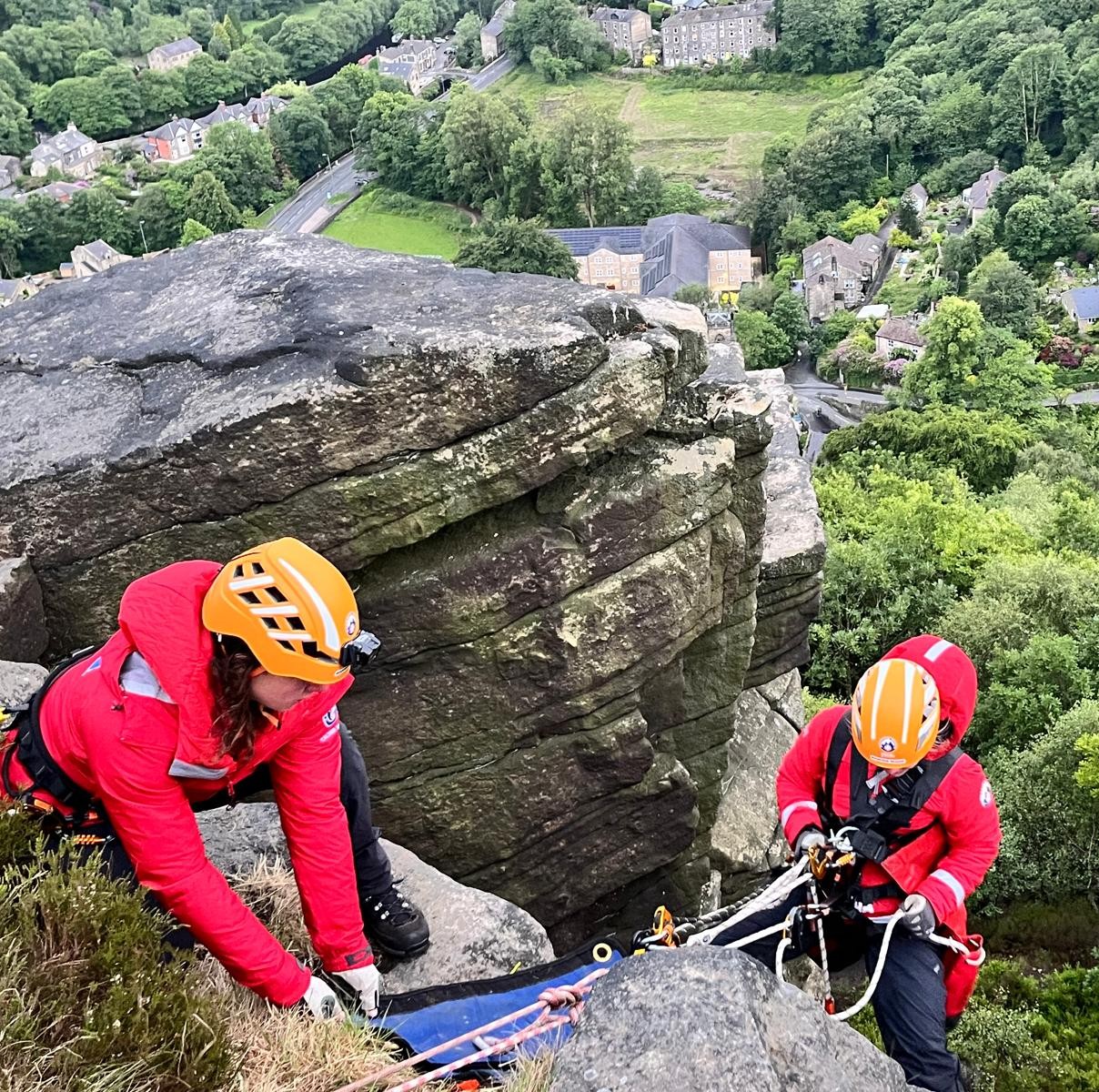 Two team members performing a technical rope rescue.