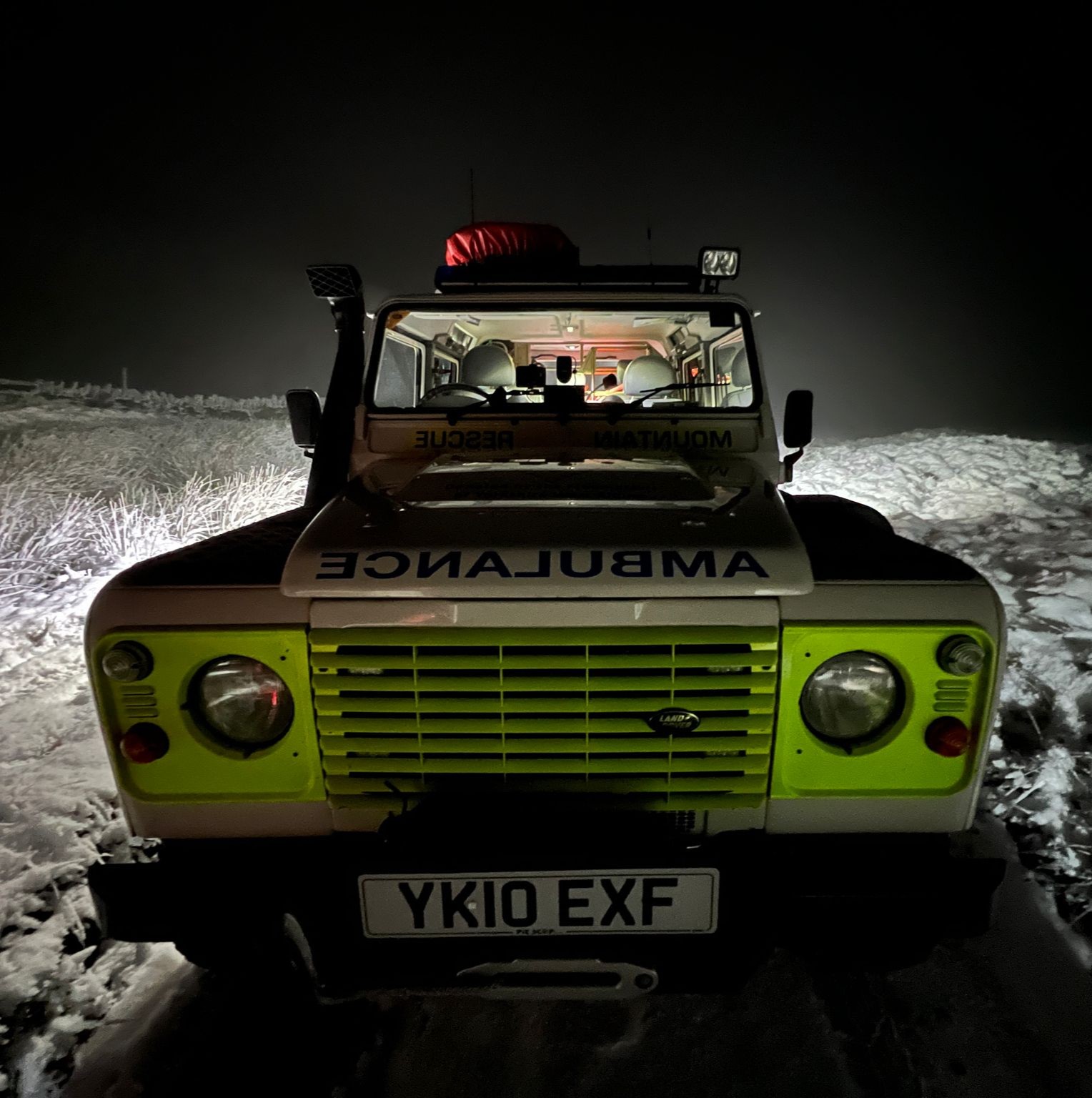 Mobile 2 - a Landrover in the snow at night.